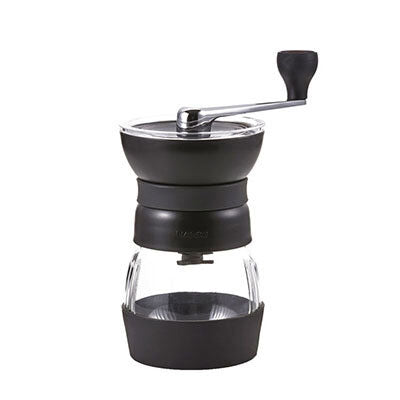 Hario Skerton Pro ceramic coffee mill with hand crank and glass container for fresh coffee grounds.